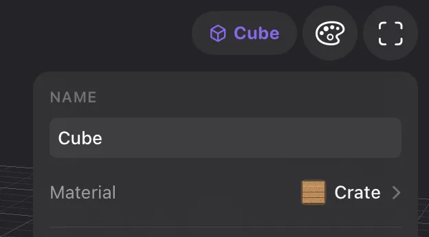 The Inspector on the right of the viewport, with the object's name, Cube, and below it the Material row: a crate thumbnail, the material name Crate, and a chevron.